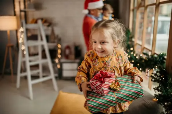 A child opening a Christmas Present